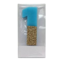 a blue and gold number one pin in a package with glitter on the bottom part