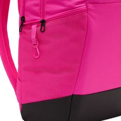 Grab your gear and get going with the Nike Brasilia Backpack. It has plenty of pockets to help you stay organized, including a sleeve to fit your laptop, side mesh pockets for water bottles, and a zippered pocket on the inside to keep small items secure. This product is made with at least 50% recycled polyester fibers. Haul loop at the top. Spacious main compartment. Padded, adjustable shoulder straps. Front zip pocket. Internal laptop sleeve. Dimensions: 18" H x 12" W x 7" D. Capacity: 24 L. Sh Functional Pink Outdoor Backpack, Pink Functional Outdoor Backpack, Pink Nylon Outdoor Backpack, Pink School Backpack With Water Bottle Pocket, Pink School Bag With Water Bottle Pocket, Functional Pink Backpack, Functional Pink Sports Backpack, Pink Outdoor Backpack With Water Bottle Pocket, Nike Functional Backpack For Outdoor Activities