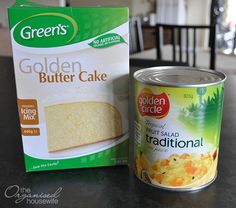 a can of golden butter cake next to a box of pudding mix on a table