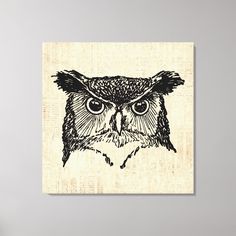 an owl is shown in black and white on a linen wall hanging above a bed