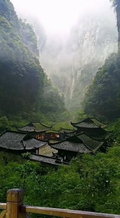 an outdoor area with mountains and trees in the background