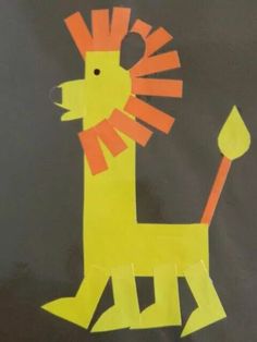 a child's drawing of a lion on a blackboard with orange and yellow strips