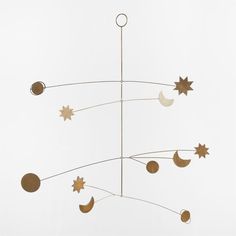 a metal wind chime with stars and moon on it