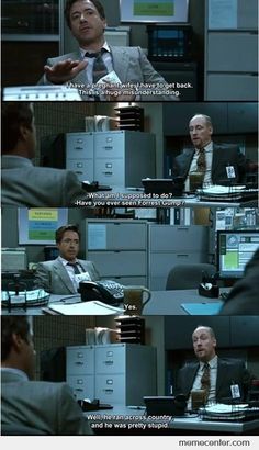 an office scene with two men talking to each other and the caption is in english