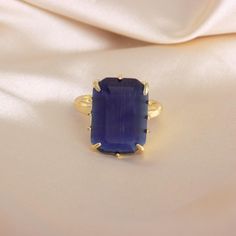 This blue cat eye ring is absolutely stunning. It is a great statement piece and also great for everyday use. Beautiful white color will go with any outfit. Ring Size: Adjustable (One size fits most, Sizes 6-9.) Stone: Blue Cat Eye Stone Size: Approximately 0.625in x 0.75in Material: 24K Gold Plated - You will receive the exact ring shown in pictures. The stone may have imperfections such as cracks, holes etc due to the raw nature of the stone. - Ships in 1-2 business days from NYC. Gift boxed. More Gemstone Rings: www.etsy.com/shop/LoveLilyandChloe?section_id=17608060 To see more of my creations go to our shop:  www.etsy.com/shop/LoveLilyandChloe Gemstone Earrings: www.etsy.com/shop/LoveLilyandChloe?section_id=16507681 Gemstone Necklaces: www.etsy.com/shop/LoveLilyandChloe?section_id=1650 Blue Cat Eye, Cat Eye Stone, Cats Eye Ring, Astoria Ny, Cats Eye Stone, Gemstone Necklaces, Blue Cat, Large Crystal, Eye Ring