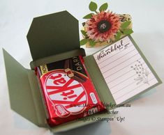 an open box with a candy bar in it