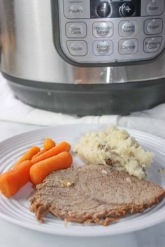 a white plate topped with meat and carrots next to an instant pot roaster