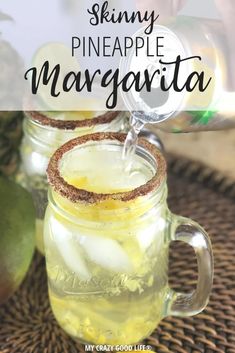 two mason jars filled with pineapple margarita