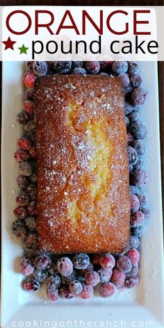 orange pound cake on a plate with blueberries