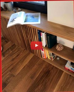 a book shelf with books and magazines on it