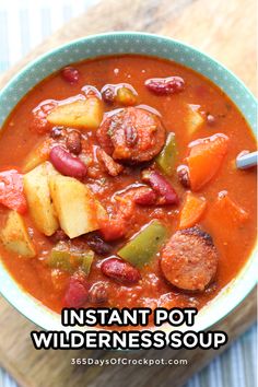 a bowl of instant pot wilderness soup with sausage, potatoes and carrots