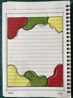 an open notebook with lined paper and colored lines on it, sitting on top of a blue mat