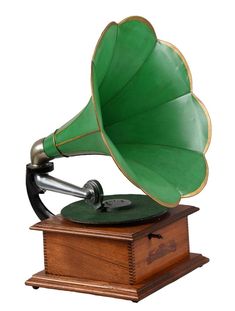 an old record player with a green horn on it's top and wooden base