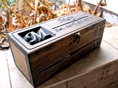 an empty wooden box sitting on the ground