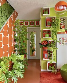 a room with green and orange walls, plants on the wall and red carpeted floor