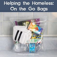 a bag filled with items sitting on top of a counter next to a tiled wall