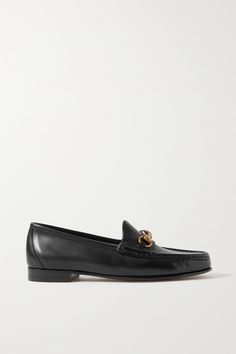 Gucci originally released its iconic horsebit loafers in 1953, and the style has been a classic ever since. Made in Italy from soft black leather, they have a simple design and cushioned insoles for comfort. Style yours with cropped jeans and a tee, or try them with tailoring for the office. Classic Leather Loafers With Horsebit Detail, Leather Horsebit Loafers, Classic Black Loafers With Horsebit Detail, Gucci Formal Loafers With Horsebit Detail, Gucci Horsebit Loafers, Horsebit Loafers, Snow Wear, Timeless Watches, Gucci Horsebit