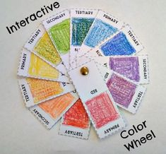 the color wheel is made up of different colored crayons with words written on them