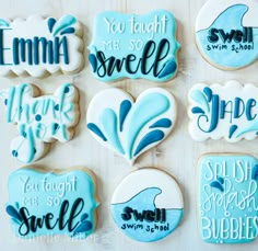 cookies decorated with blue and white icing that say you taught the smell of smile