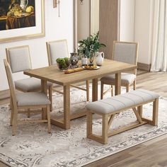 a dining table with four chairs and a bench in front of it on a rug