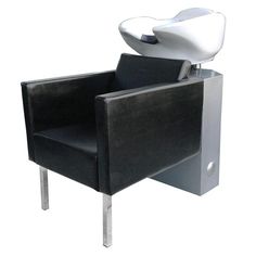 a black chair with a white hair dryer on it's back and arm