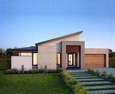 a modern house with steps leading up to the front door