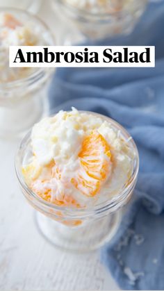 an orange and yogurt dessert in small glass dishes with the words ambrosia salad above it