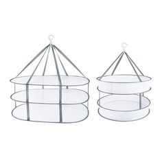 two round glass shelves with metal wire hanging from the top and bottom, one on each side