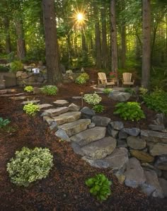 the sun shines brightly through the trees in this backyard garden with stone steps and seating area