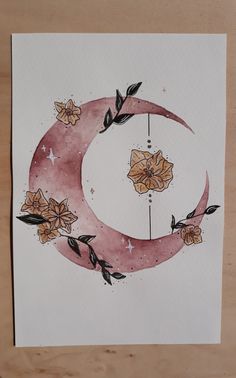 a drawing of a crescent with flowers on it