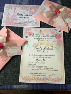 the wedding stationery is laid out on top of the table with ribbons and bows