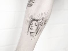 a woman's arm with a tattoo on it