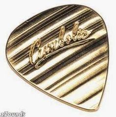 a gold tone guitar picker with the word,'rock and roll'written on it