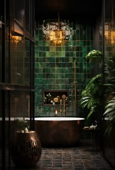 a bath tub sitting next to a green tiled wall