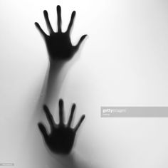 the shadow of two hands on a white background stock photo getty images black and white photography