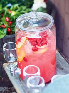 a glass jar filled with water and fruit