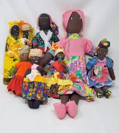 a group of dolls sitting next to each other