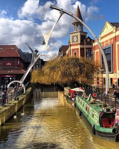 the boats are parked on the side of the river