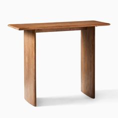 a wooden table that is standing up against a white background with the top half turned down