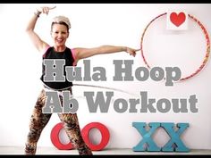 a woman holding a hula hoop in front of a wall with the words hula hoop ab workout