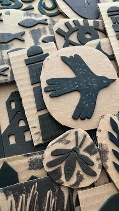 several different types of paper cut outs with black and white designs on them