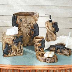 bathroom accessories including soap dispenser, toothbrush holder and bear figurines