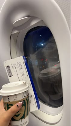 a cup of coffee and a ticket on an airplane