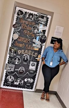 a woman standing in front of a chalk board