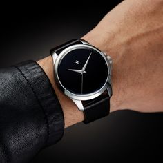 Minimalist Analog Watches For Formal Occasions, Minimalist Business Watch With Rectangular Dial, Classic Black Watch With Polished Finish, Classic Black Watch Accessories For Everyday, Classic Matte Black Watch For Formal Occasions, Minimalist Formal Watch With Round Dial, Minimalist Formal Watch, Elegant Black Watch Accessories For Business, Minimalist Formal Watches