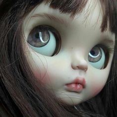 a close up photo of a doll's eyes