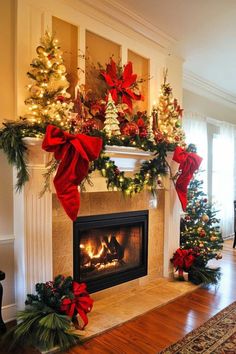 a fireplace decorated for christmas with red bows and poinsettis