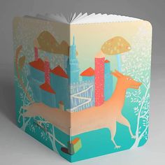 an open book with a drawing of a dog and mushrooms on the cover, in front of a cityscape