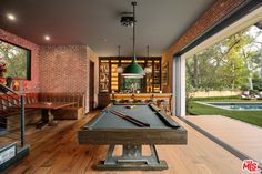 a pool table in the middle of a room