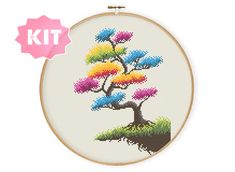 a cross stitch kit with a colorful bonsai tree